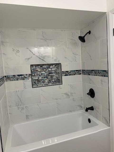851 150th Street Hammond, IN 46327 - Photo 11 of 13 a bathroom with a bathtub and a shower
