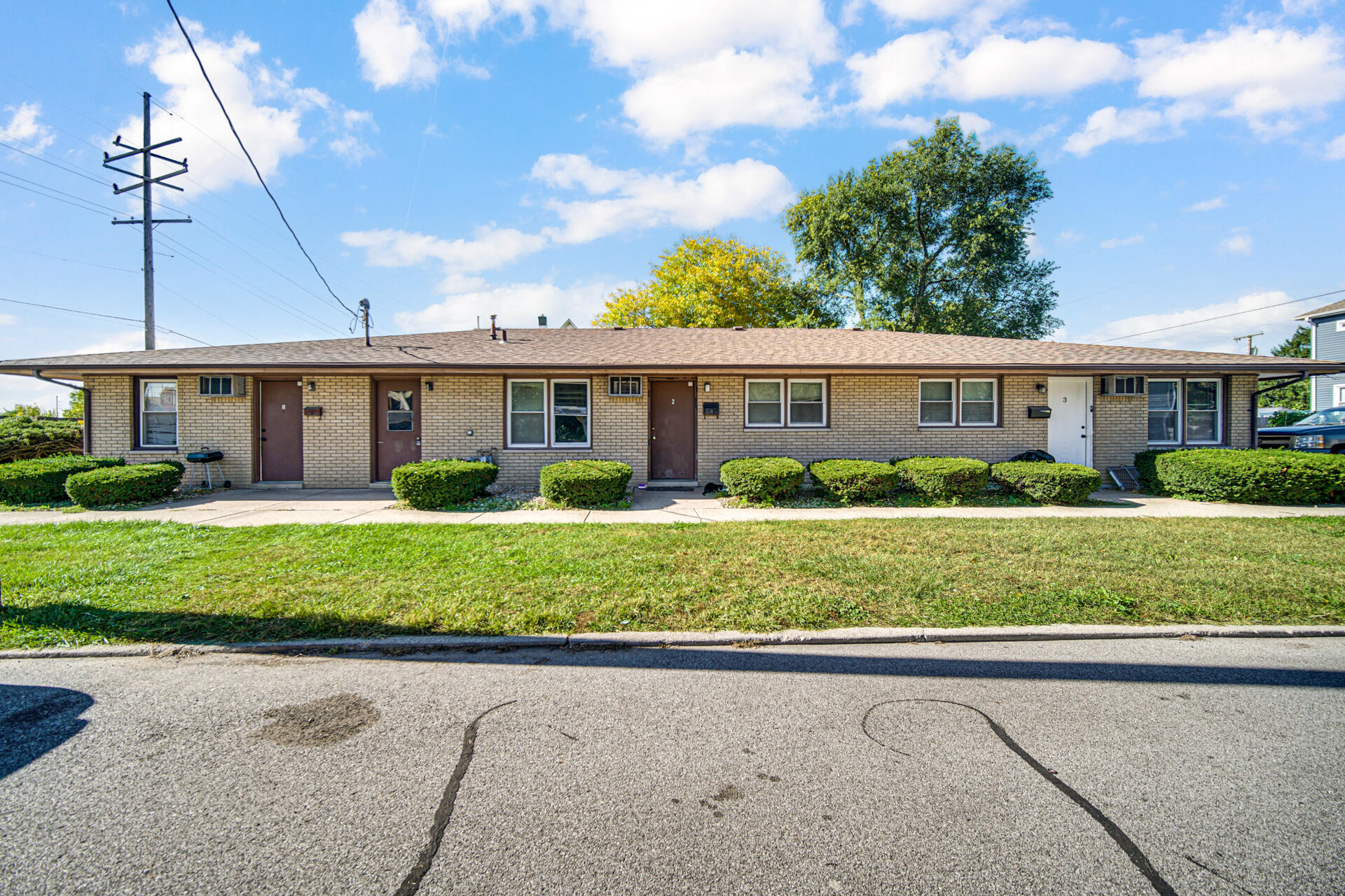 851 150th Street Hammond, IN 46327 - Photo 2 of 13 a front view of a house with a garden