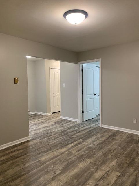 851 150th Street Hammond, IN 46327 - Photo 9 of 13 an empty room with wooden floor and windows
