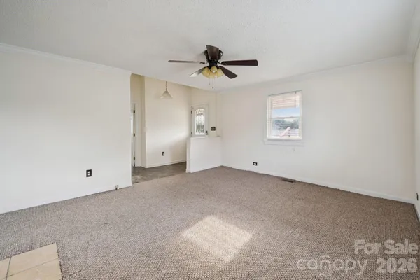 a view of a ceiling fan in a room