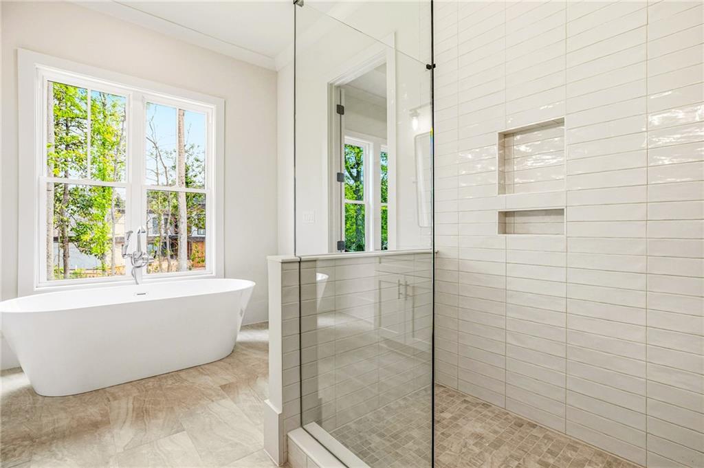 1967 Highgrove Court Decatur, GA 30033 - Photo 23 of 60 a bathroom with a bathtub and shower