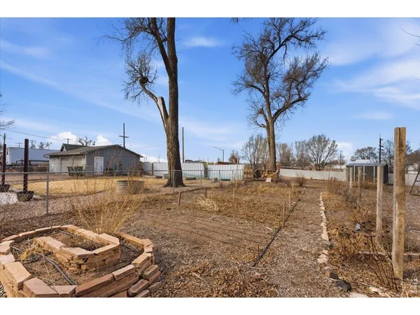 a view of a backyard of the house