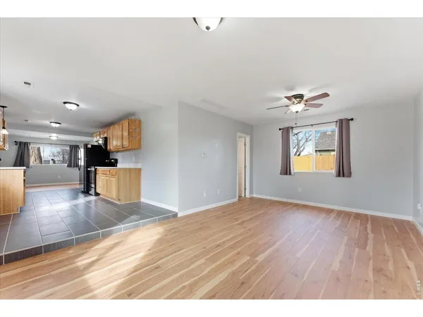 a kitchen with stainless steel appliances granite countertop a refrigerator stove top oven and sink
