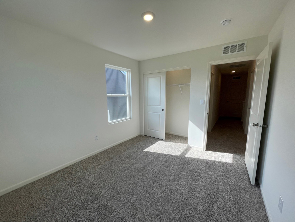 10 International Way Joliet, IL 60421 - Photo 12 of 32 an empty room with windows and closet