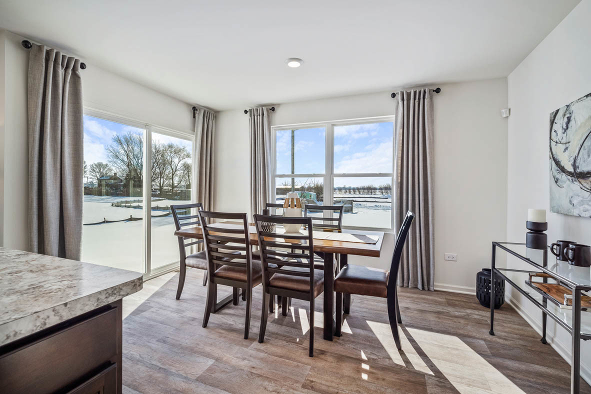 10 International Way Joliet, IL 60421 - Photo 18 of 32 a dining room with furniture and wooden floor