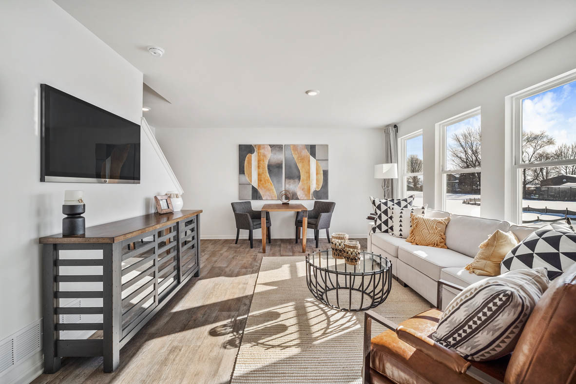 10 International Way Joliet, IL 60421 - Photo 19 of 32 a living room with furniture a flat screen tv and a large window