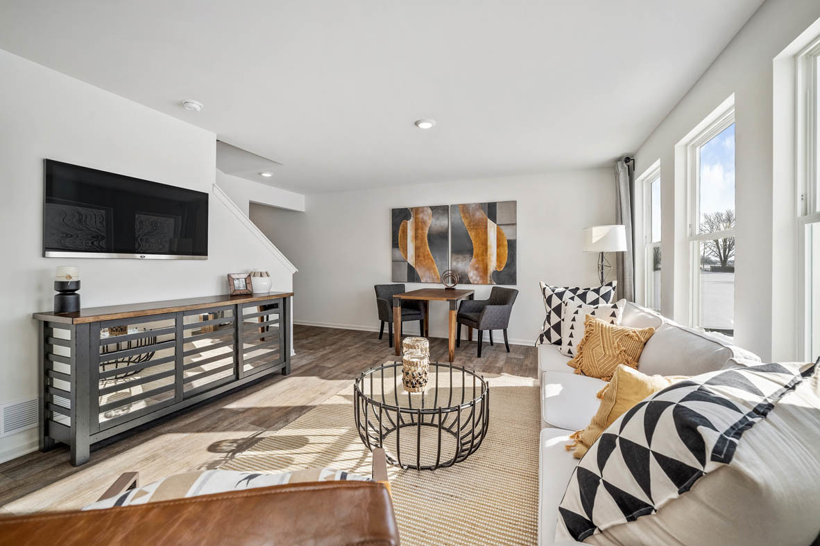 10 International Way Joliet, IL 60421 - Photo 20 of 32 a living room with furniture and a flat screen tv