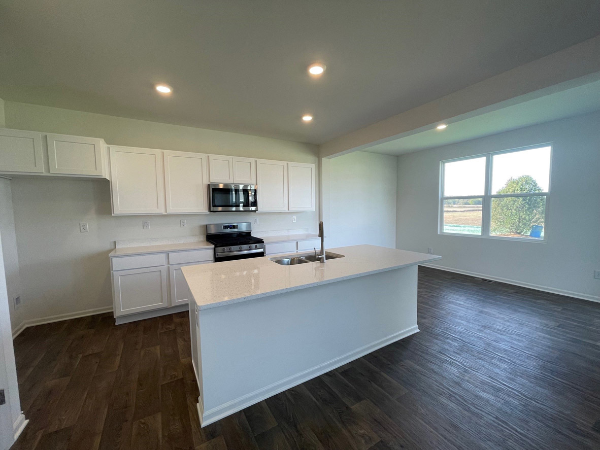 10 International Way Joliet, IL 60421 - Photo 2 of 32 a kitchen with counter top space cabinets and appliances