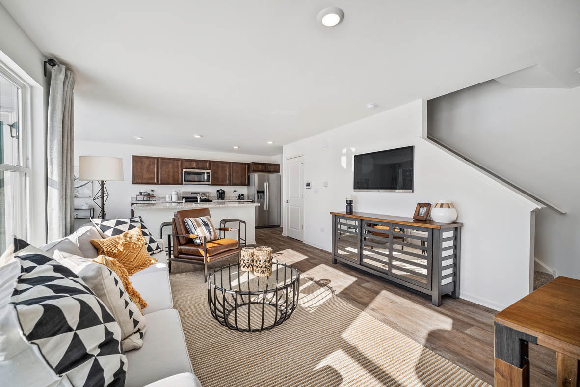 10 International Way Joliet, IL 60421 - Photo 21 of 32 a living room with furniture and a flat screen tv