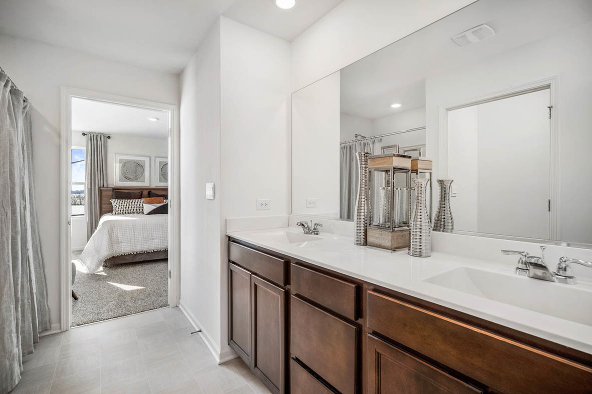 10 International Way Joliet, IL 60421 - Photo 25 of 32 a en suite bathroom with a sink and a mirror
