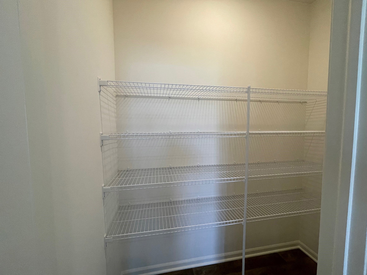 10 International Way Joliet, IL 60421 - Photo 4 of 32 a bathroom with a glass shower door