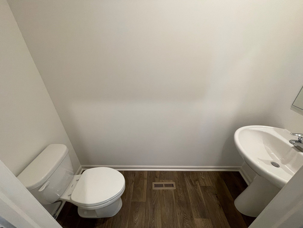 10 International Way Joliet, IL 60421 - Photo 5 of 32 a bathroom with a toilet and a sink