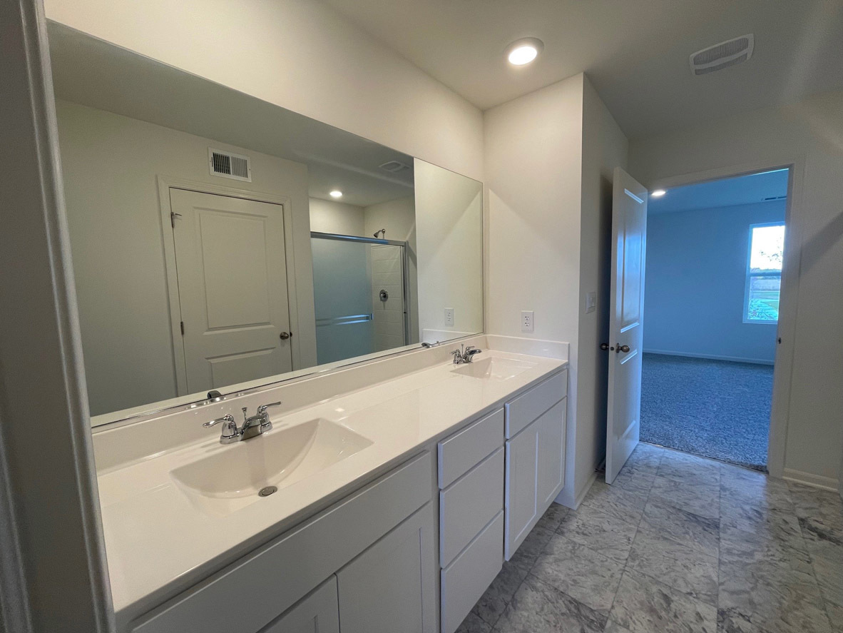 10 International Way Joliet, IL 60421 - Photo 7 of 32 a bathroom with a double vanity sink mirror and double