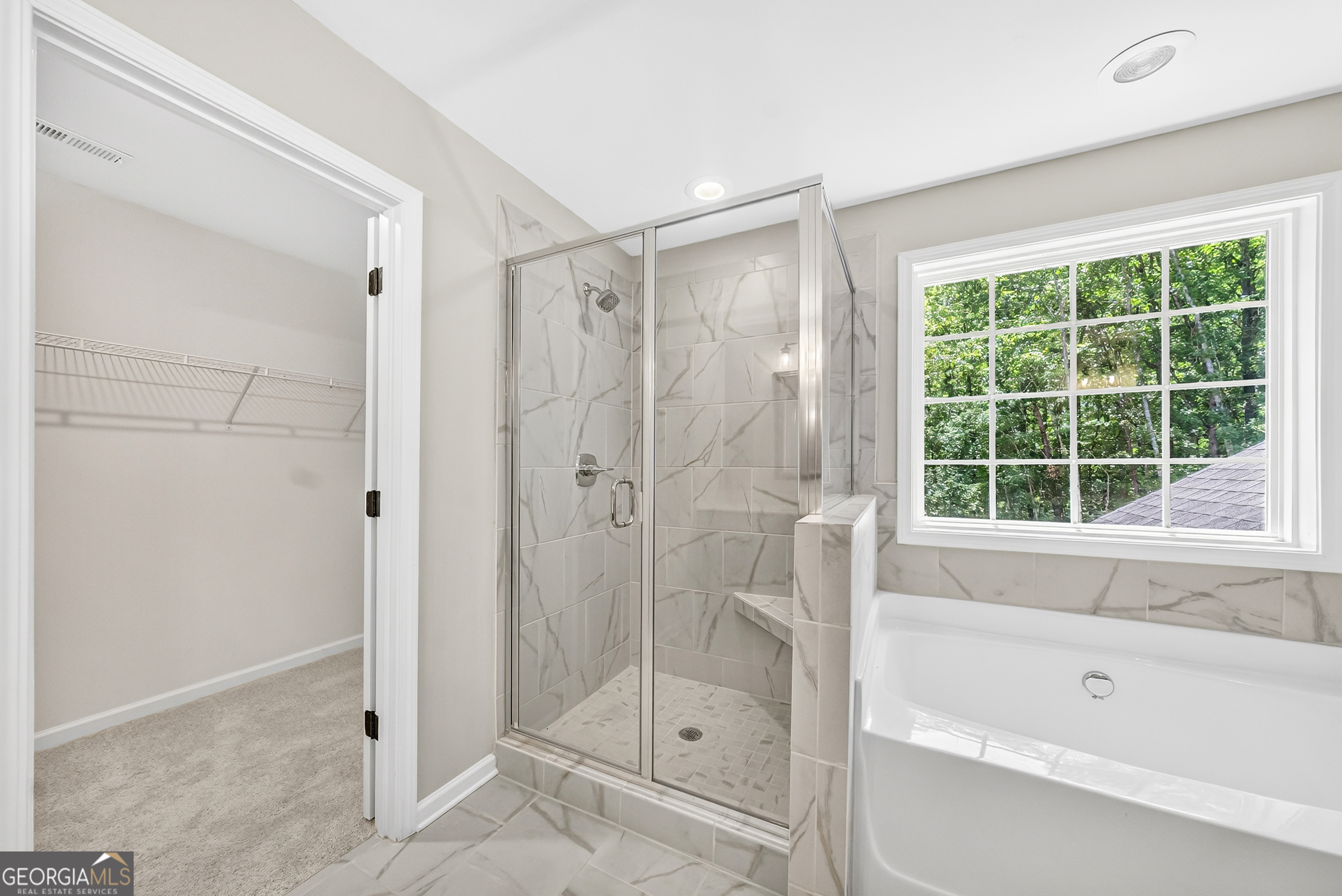38 Oak Ridge Drive, Unit 26 Waverly Hall, GA 31831 - Photo 22 of 37 a bathroom with a shower and a bathtub