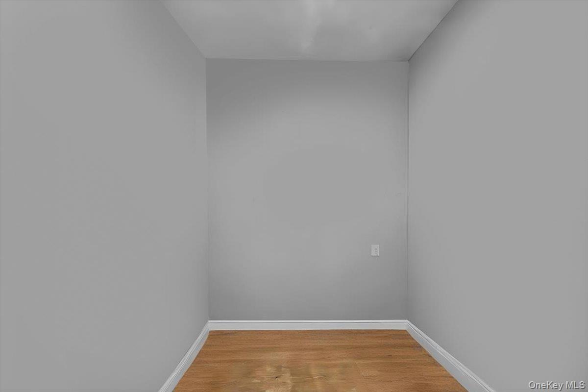 95-68 115th Street Queens, NY 11419 - Photo 17 of 28 Unfurnished room with light wood-type flooring and baseboards