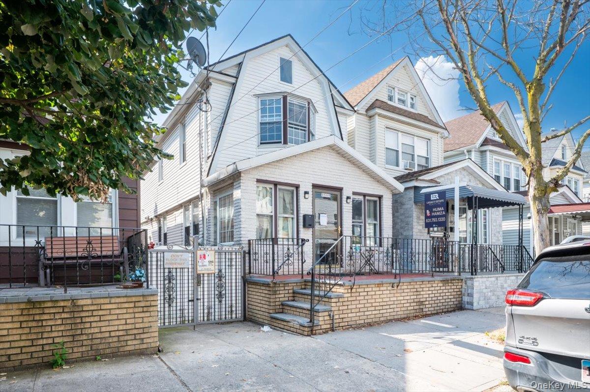 95-68 115th Street Queens, NY 11419 - Photo 2 of 28 View of front of house with a gate