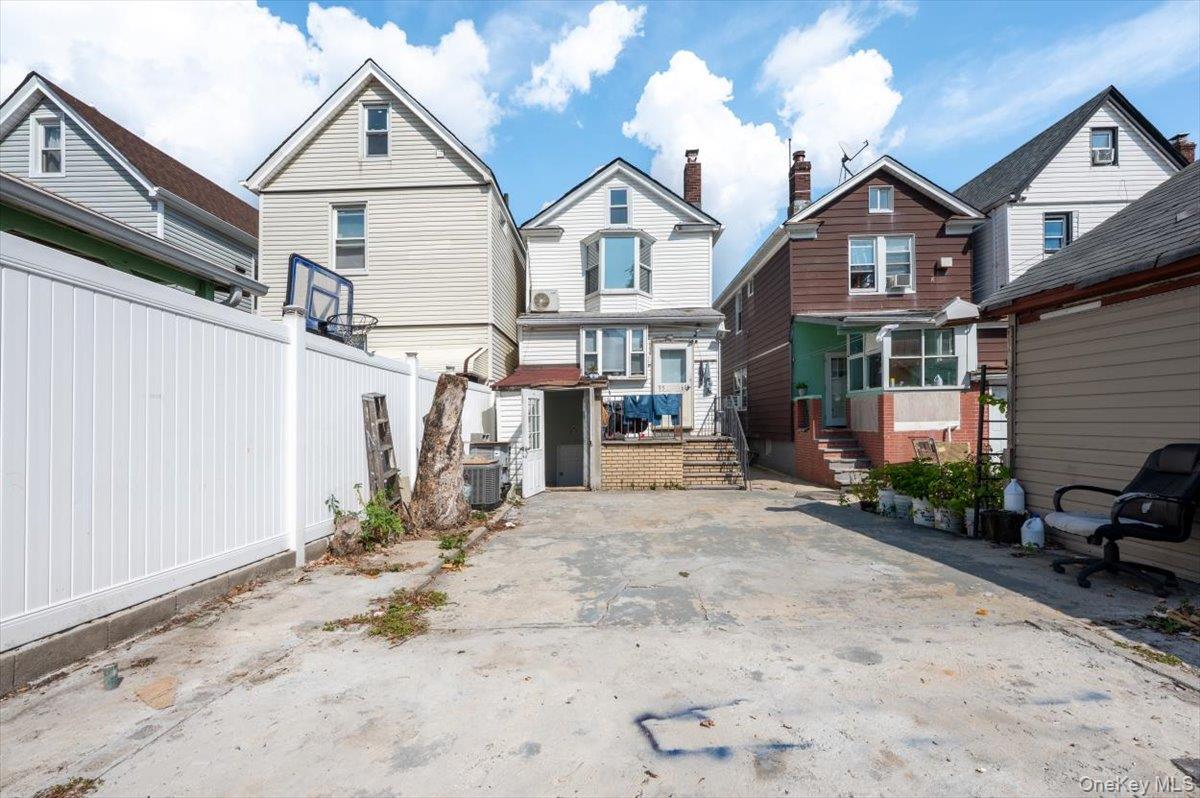 95-68 115th Street Queens, NY 11419 - Photo 24 of 28 Rear view of property with a residential view