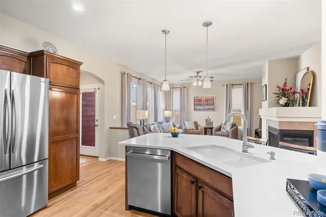 a kitchen with kitchen island a sink appliances and cabinets