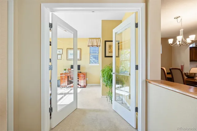 a spacious bathroom with a glass shower door and a sink