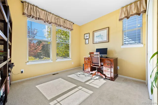 a work room with furniture and a window