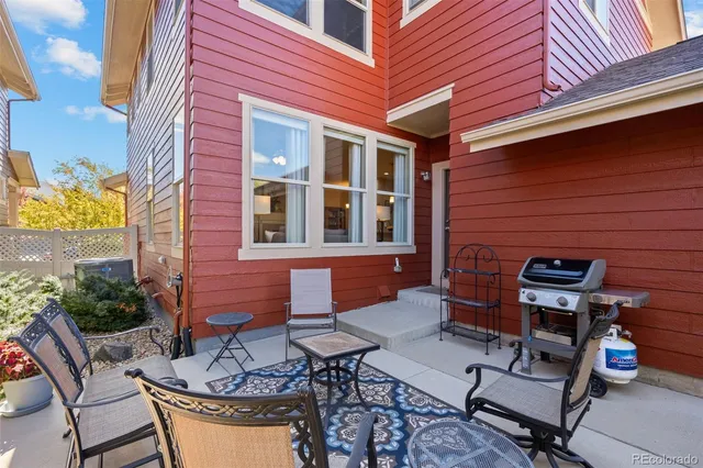 a view of backyard with outdoor seating