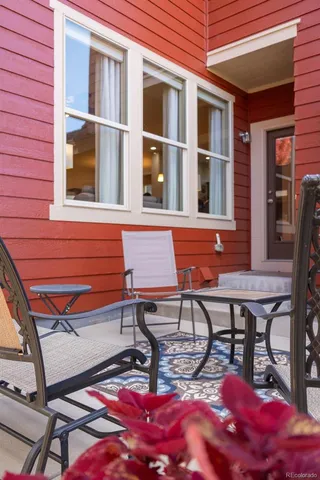 a view of a chairs and table in the balcony