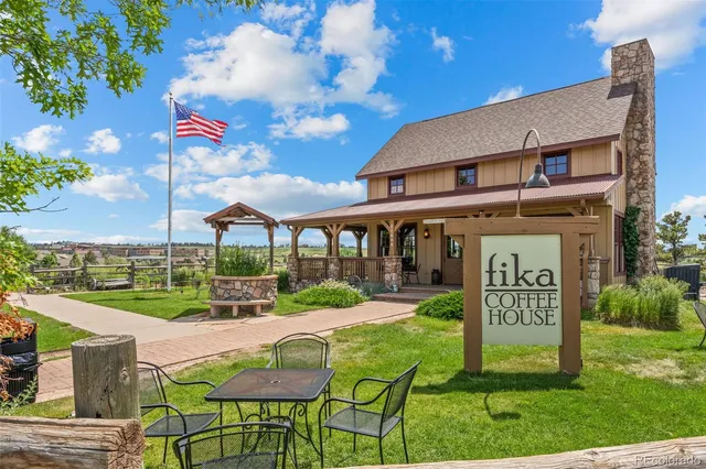 a view of a chairs and table in the yard