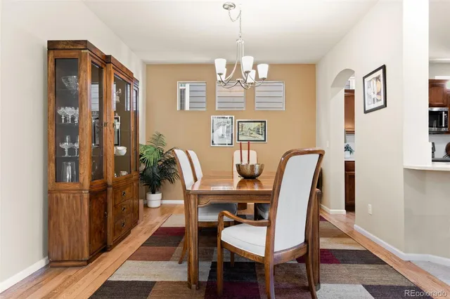 a view of a dining room with furniture and window