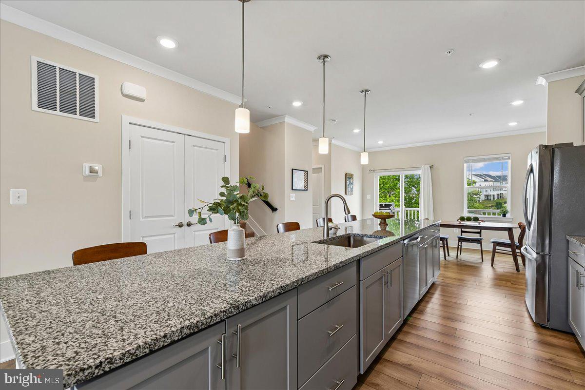 2209 Woodlands Road Windsor Mill, MD 21244 - Photo 12 of 75 RECESSED LIGHTS AND PENDANT LIGHTS OVER THE ISLAND