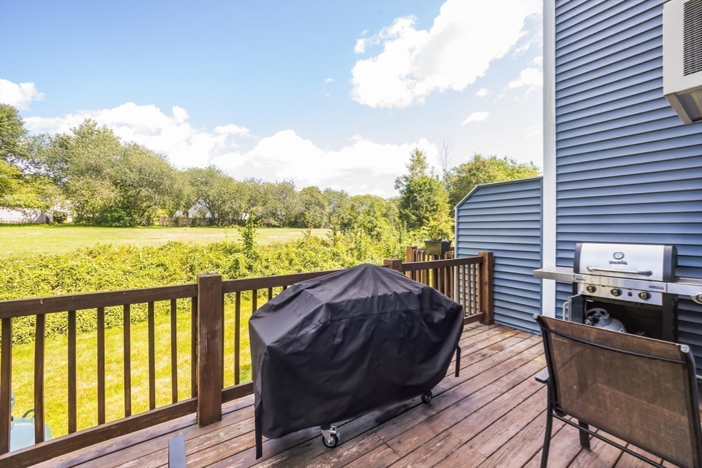 59 Seabury, Unit 59 Hampton, NH 03842 - Photo 21 of 25 a view of a chairs and table on the wooden deck