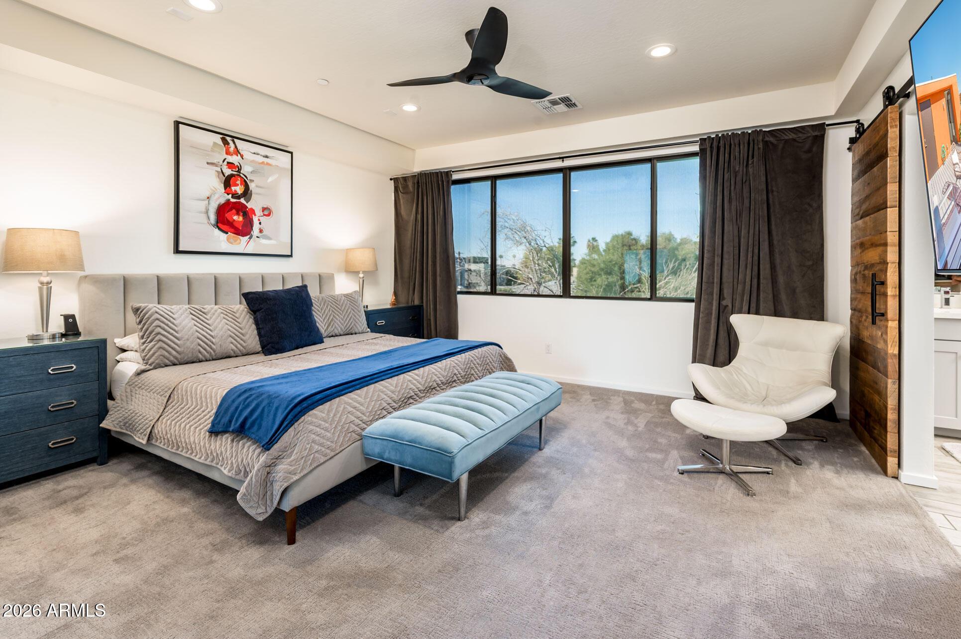 4416 North 27th Way Phoenix, AZ 85016 - Photo 20 of 46 a bedroom with a large bed and a window