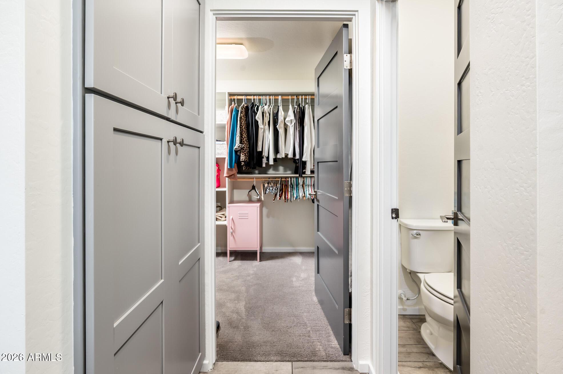 4416 North 27th Way Phoenix, AZ 85016 - Photo 24 of 46 a view of walk in closet with clothes and shoes