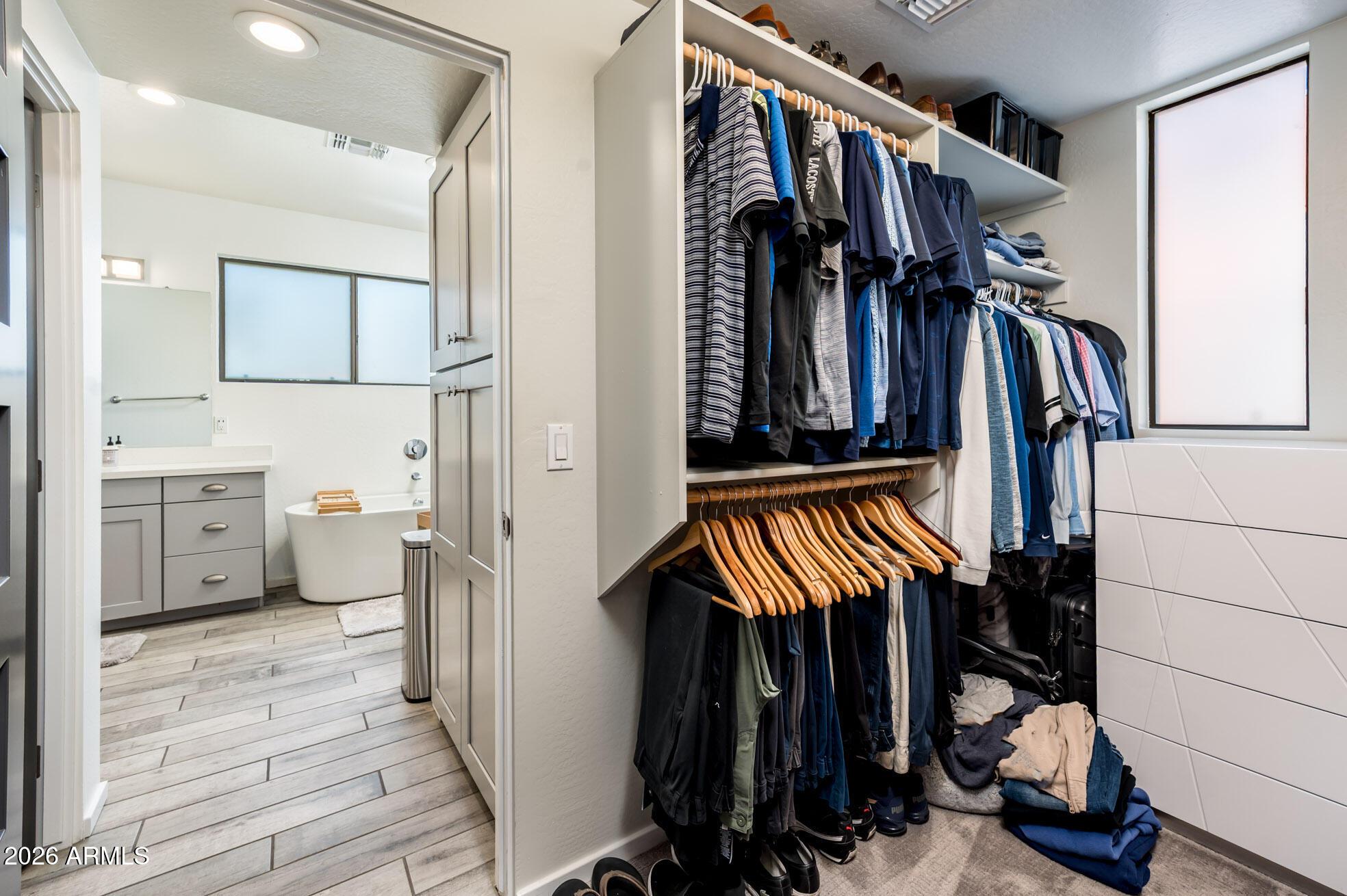 4416 North 27th Way Phoenix, AZ 85016 - Photo 26 of 46 a view of walk in closet with clothes and shoes