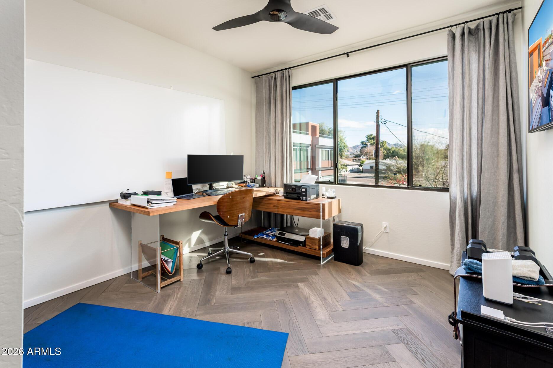 4416 North 27th Way Phoenix, AZ 85016 - Photo 30 of 46 a view of a workspace with furniture and a window