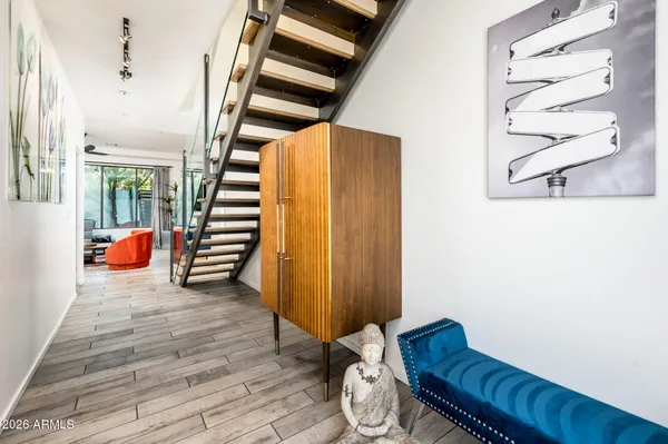 a living room with furniture and a rug
