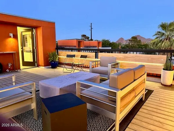 a outdoor living space with furniture and city view