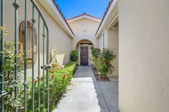 a view of a chairs and table in the balcony