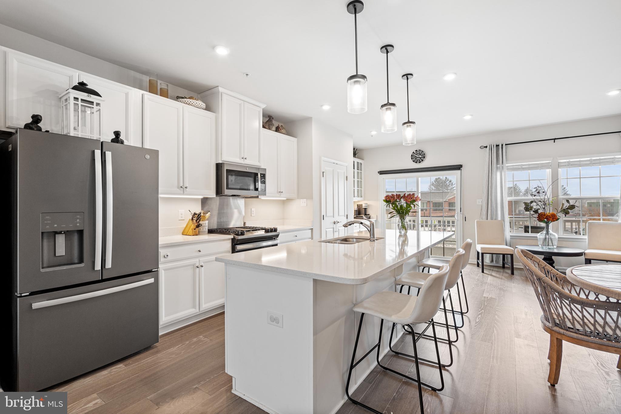 120 Bishop Way Dublin, PA 18917 - Photo 2 of 31 a kitchen with stainless steel appliances a refrigerator a stove a sink a dining table and chairs