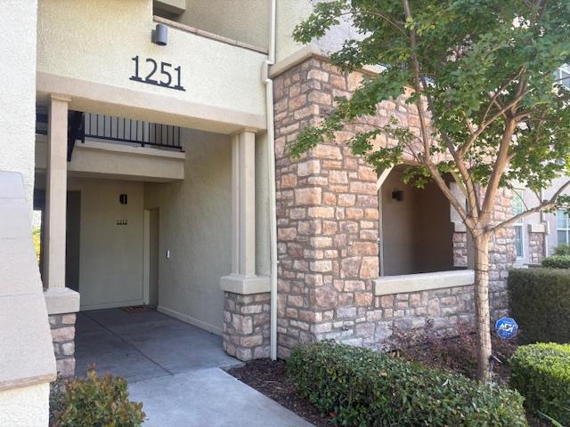 1251 Whitney Ranch Parkway, Unit 1212 Rocklin, CA 95765 - Photo 1 of 30 a front view of a house with a tree
