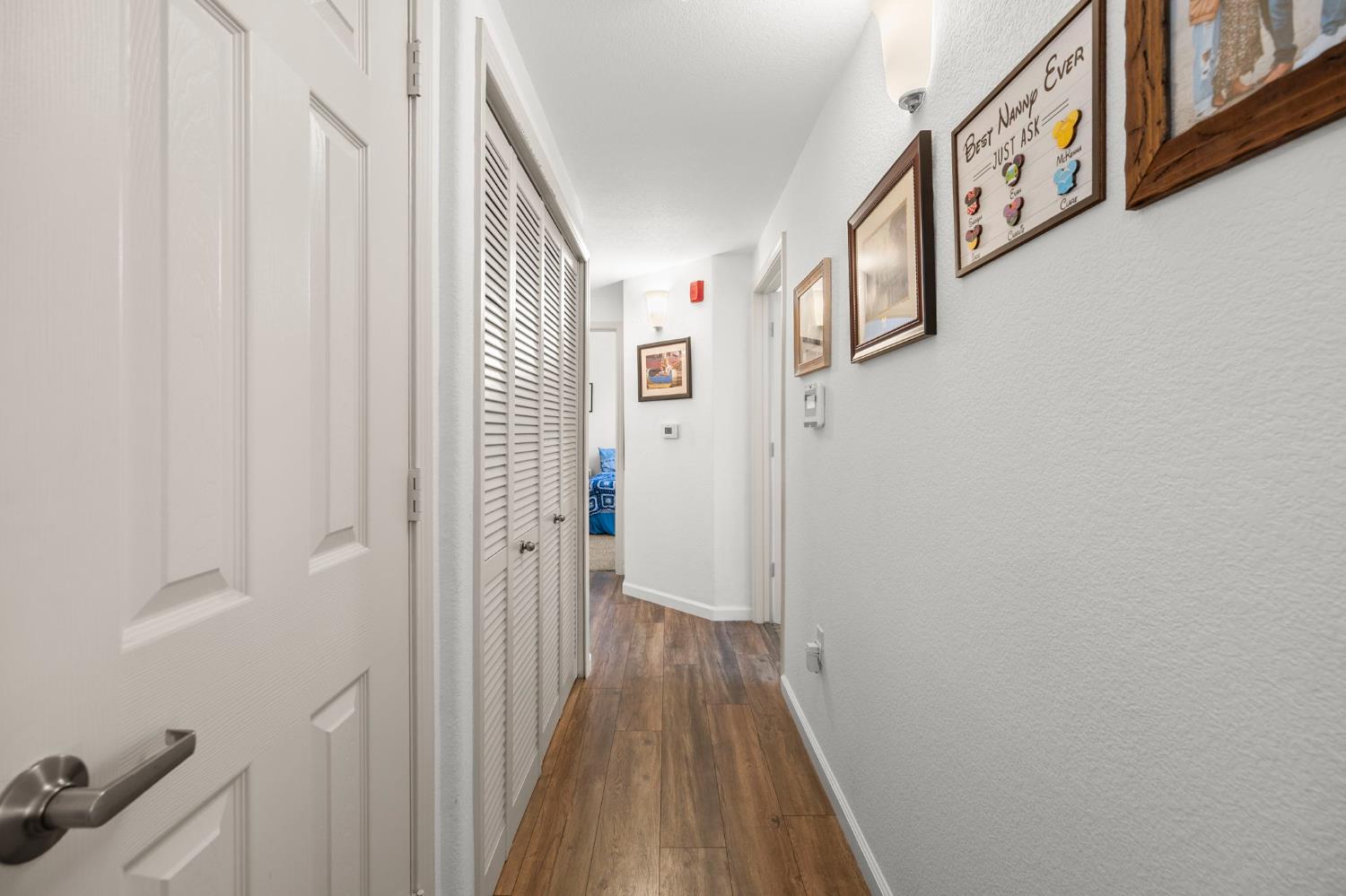 1251 Whitney Ranch Parkway, Unit 1212 Rocklin, CA 95765 - Photo 13 of 30 a view of a hallway with wooden staircase