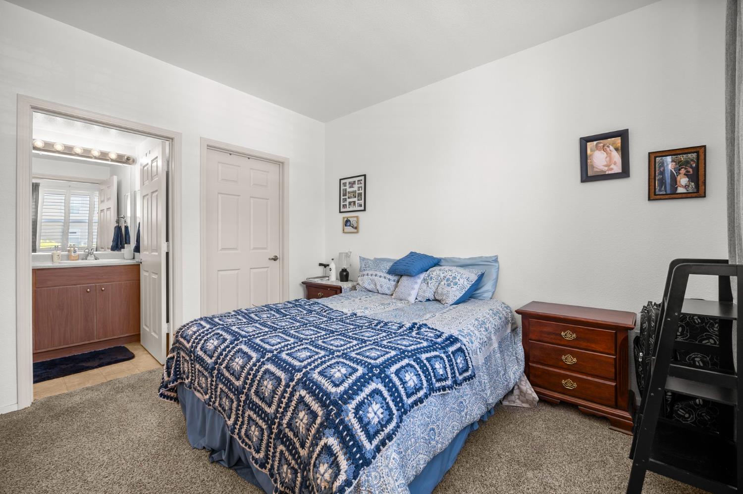1251 Whitney Ranch Parkway, Unit 1212 Rocklin, CA 95765 - Photo 15 of 30 a bedroom with a bed and a television