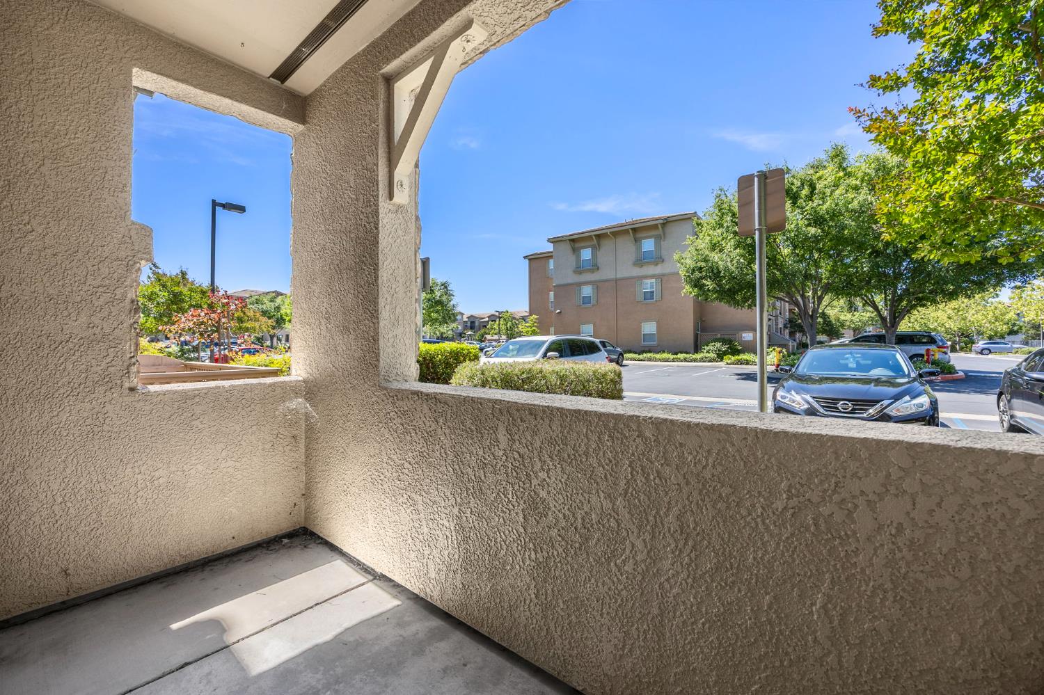 1251 Whitney Ranch Parkway, Unit 1212 Rocklin, CA 95765 - Photo 20 of 30 a view of a street with cars on road