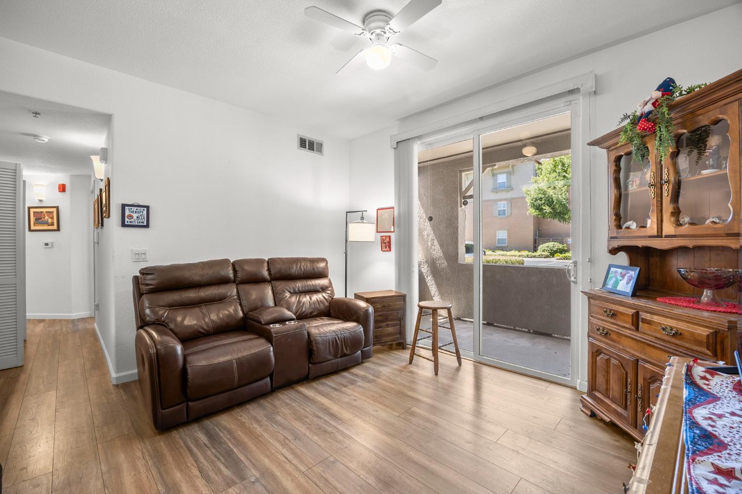 1251 Whitney Ranch Parkway, Unit 1212 Rocklin, CA 95765 - Photo 4 of 30 a living room with furniture and a fireplace