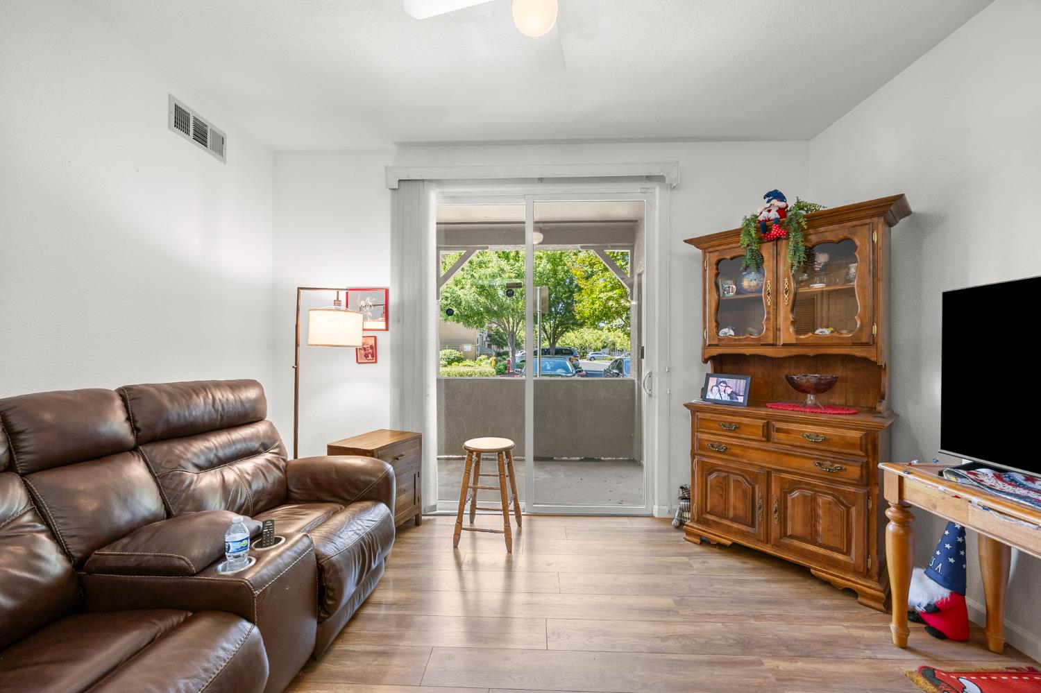1251 Whitney Ranch Parkway, Unit 1212 Rocklin, CA 95765 - Photo 5 of 30 a living room with furniture and a flat screen tv