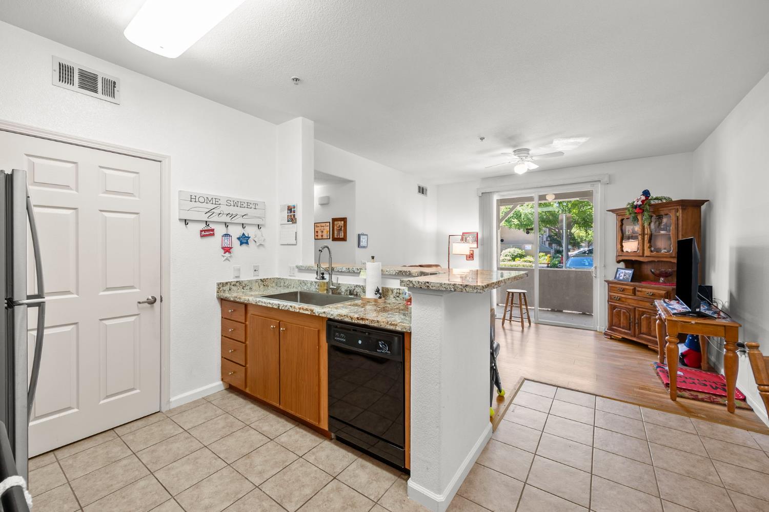 1251 Whitney Ranch Parkway, Unit 1212 Rocklin, CA 95765 - Photo 7 of 30 a kitchen with stainless steel appliances granite countertop a sink and cabinets
