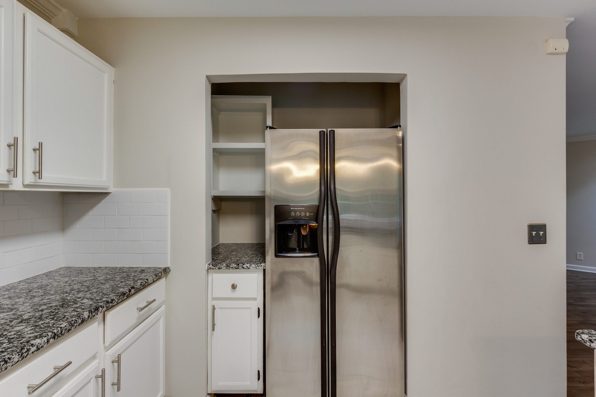 2315 Rader Ridge Road Antioch, TN 37013 - Photo 12 of 29 a kitchen with cabinets and a refrigerator