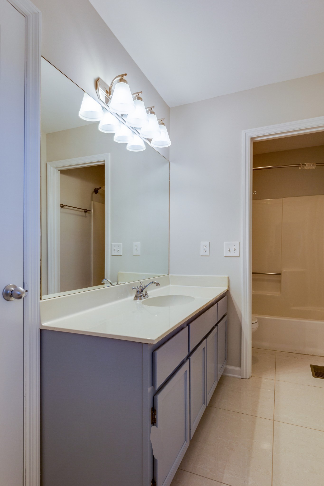 2315 Rader Ridge Road Antioch, TN 37013 - Photo 18 of 29 a bathroom with a sink a mirror and a bathtub
