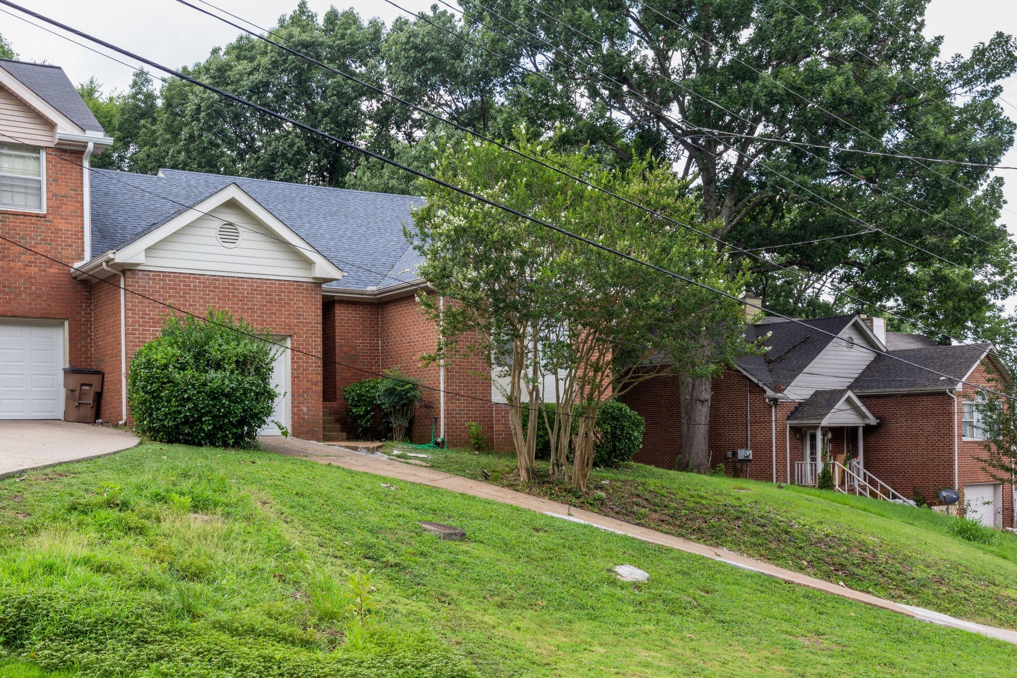 2315 Rader Ridge Road Antioch, TN 37013 - Photo 3 of 29 a front view of a house with a yard and trees