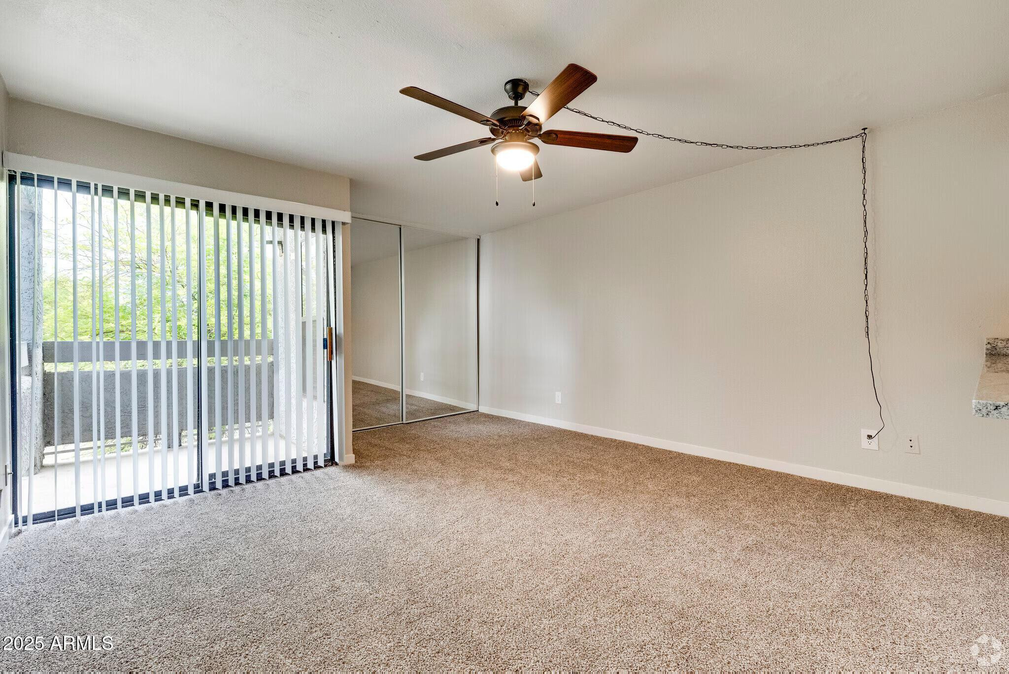 6505 East Osborn Road, Unit 1 Scottsdale, AZ 85251 - Photo 2 of 9 a view of an empty room with a window