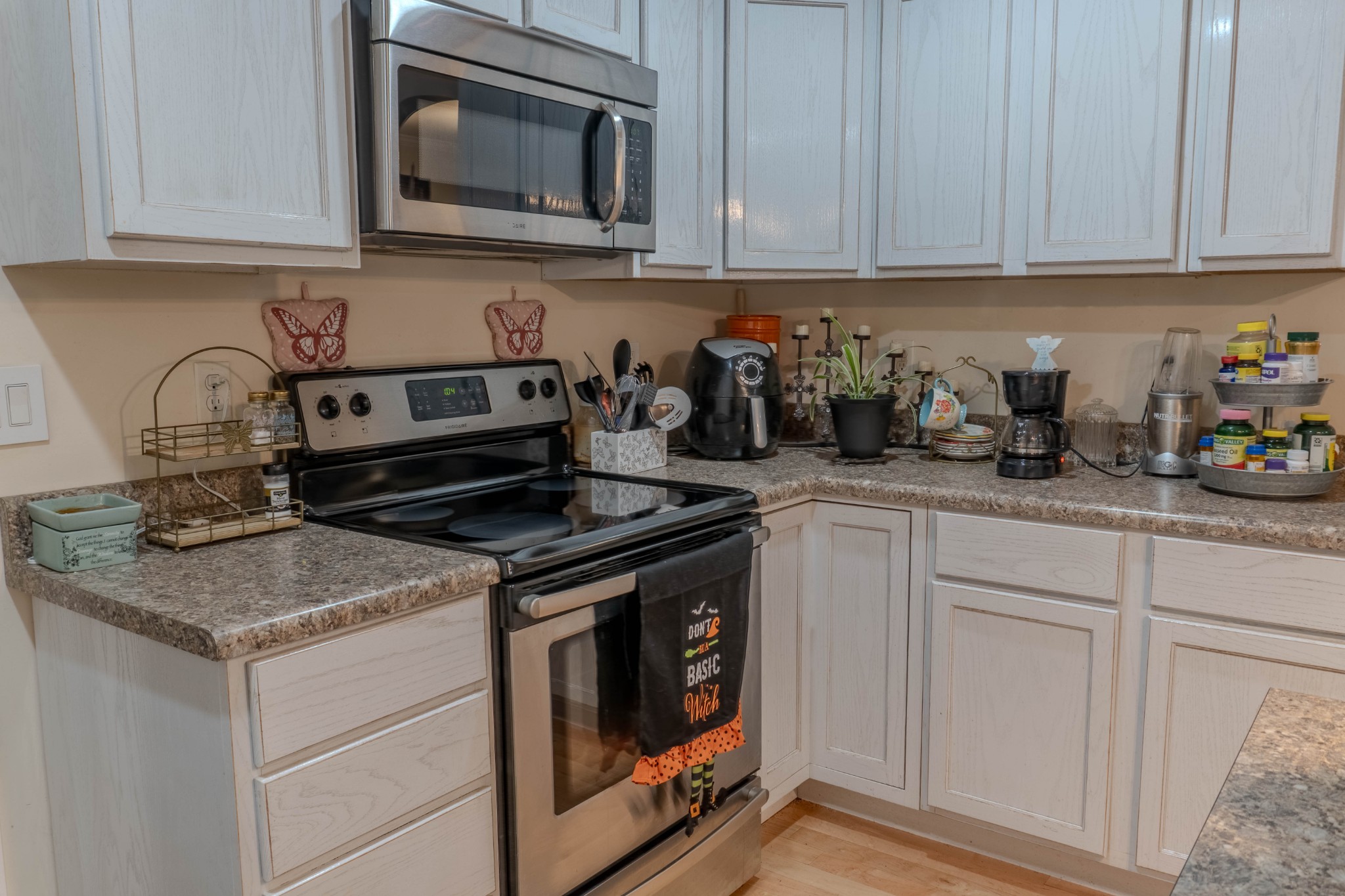 979 State Line Road Five Points, TN 38457 - Photo 13 of 23 a kitchen with granite countertop white cabinets and stainless steel appliances